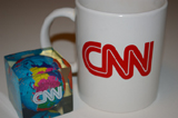 CNN mug and world paperweight