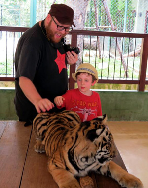 author and son with tigers