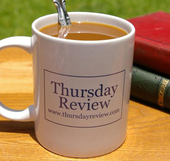 Coffee with cream in a Thursday Review mug