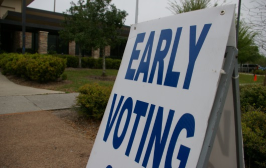 Early voting sign in front of a library