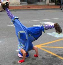 small clown doing a headstand