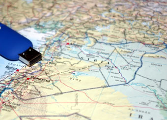flash drive on a map of Syria and Iraq.