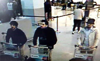 men pushing carts with suspicious items