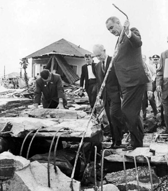 President Lyndon B Johnson examining hurricane damage