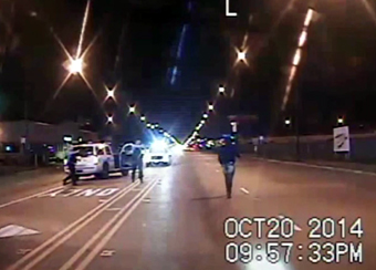 Still frame from dash camera in Chicago police car one second before Laquan McDonald was shot by police