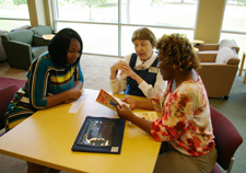 Librarians helping students