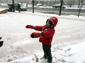 
Fun in the snow along 1st Avenue, Midtown East, Manhattan