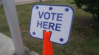 Vote here sign